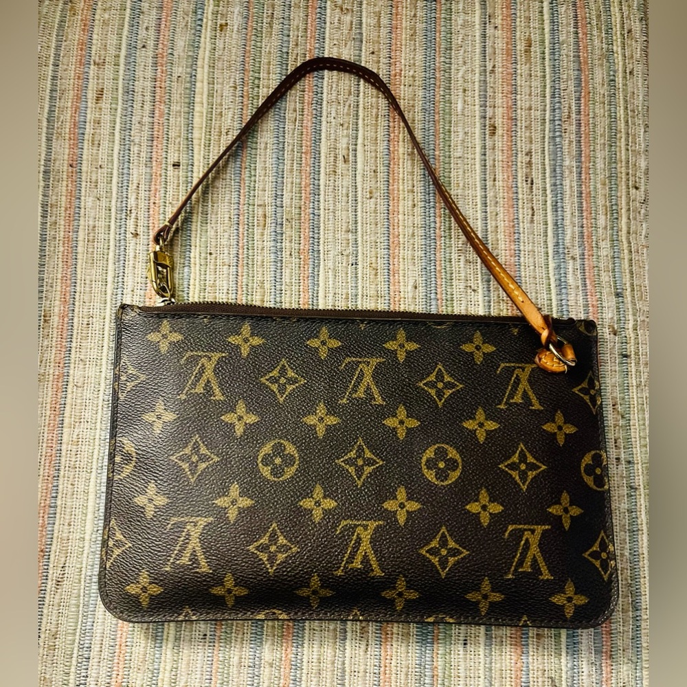 Authentic Louis Vuitton Neverfull wristlet.